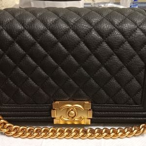 A CHANEL black leather boy bag